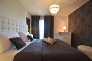Postel nebo postele na pokoji v ubytování Apartments Antonija + 37 fotografií