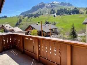 a balcony with a view of a mountain at Le Lessy M2 in Le Grand-Bornand
