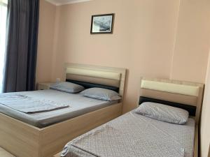 Ліжко або ліжка в номері Eri Apartments 3