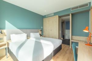Posteľ alebo postele v izbe v ubytovaní Holiday Inn Barcelona - Sant Cugat by IHG