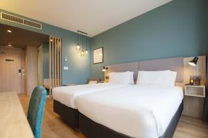 Posteľ alebo postele v izbe v ubytovaní Holiday Inn Barcelona - Sant Cugat by IHG