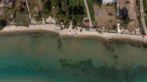 an aerial view of a beach in the ocean at Sapfo Beach Studios in Nikiti