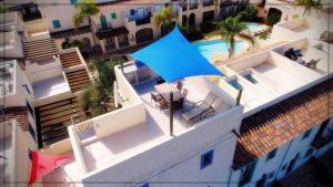 Bazén v ubytování La Casita de la Playa 24-38 nebo v jeho okolí