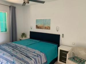 Postel nebo postele na pokoji v ubytování La Casita de la Playa 24-38 + 17 fotografií