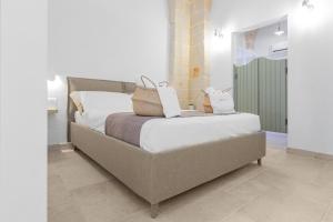 Krevet ili kreveti u jedinici u okviru objekta Filia Solis - Old Town SUITEs & SPA