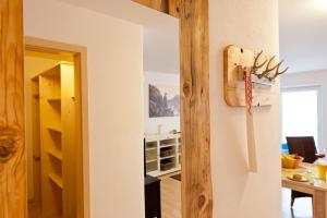 a kitchen and dining room with a refrigerator at Ferienwohnungen Alpentraum - Traumblick in Bolsterlang