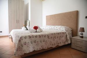 Ένα ή περισσότερα κρεβάτια σε δωμάτιο στο Anthea Sorrento