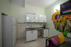 A kitchen or kitchenette at XALİLA HOSTEL & CAFE LADİES ROOM