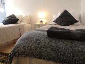 A bed or beds in a room at Stockholm B&B Cottage