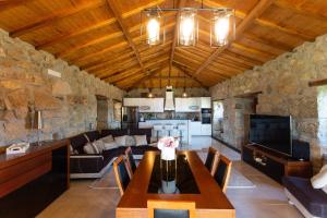 a living room with a table and a couch at Quinta da Bela vista in Celorico de Basto