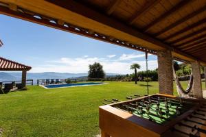 a view of a yard with a pool and a house at Quinta da Bela vista in Celorico de Basto