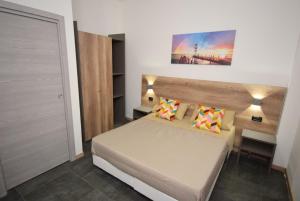 Postel nebo postele na pokoji v ubytování Hotel Crisvan