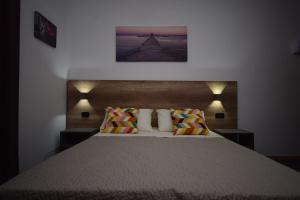 Postel nebo postele na pokoji v ubytování Hotel Crisvan