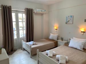 Postel nebo postele na pokoji v ubytování Velonis Apartments