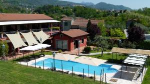 an aerial view of a house with a swimming pool at Albergo la Luna in Sarzana