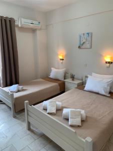 Postel nebo postele na pokoji v ubytování Velonis Apartments