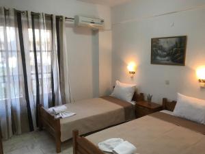 Postel nebo postele na pokoji v ubytování Velonis Apartments