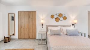 Cama ou camas em um quarto em Lumiére spetses