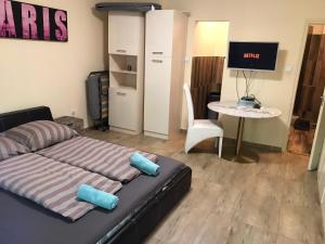 Posteľ alebo postele v izbe v ubytovaní Roland Apartmant Zuglo