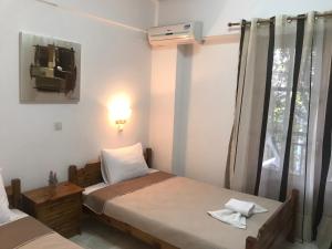 Postel nebo postele na pokoji v ubytování Velonis Apartments