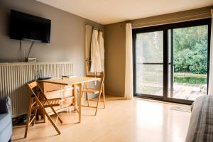 TV a/nebo společenská místnost v ubytování B&B 't Solveldje