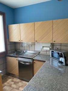 A kitchen or kitchenette at Oasi