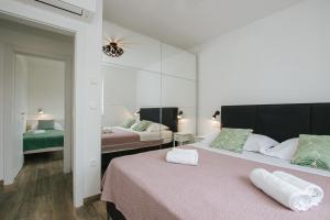 Säng eller sängar i ett rum på Luxury Apartments Marija