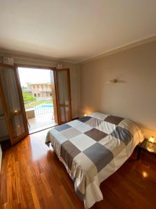 A bed or beds in a room at Oasi