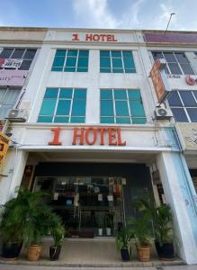 a hotel with a sign that reads i hotel at 1 Hotel Taman Connaught in Kuala Lumpur