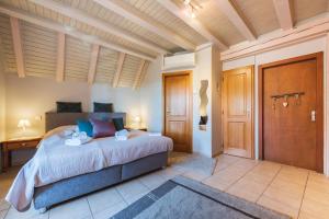 a bedroom with a bed and a desk in it at Domaine Bleesz in Reichsfeld