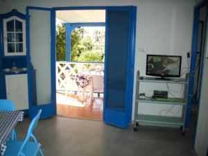 Holiday home Riserva Marina Protetta tesisinde bir televizyon ve/veya eğlence merkezi