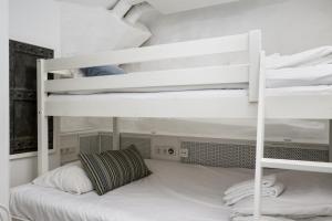 a bedroom with two bunk beds in a room at Hotell Skeppsbron in Stockholm