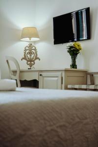 Кровать или кровати в номере Palazzetto Barnaba