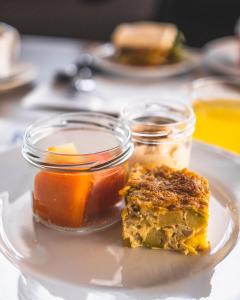 a plate with a piece of food on a table at Hotel Adonis Plaza in Santa Cruz de Tenerife