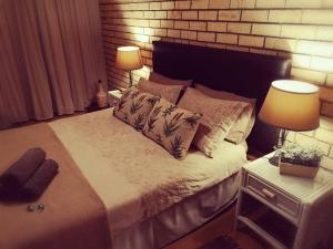 Säng eller sängar i ett rum på Bushmans River Holliday House Retreat