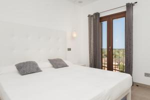 Ένα ή περισσότερα κρεβάτια σε δωμάτιο στο NEW! Villa Can Vadell - Calonge +50 φωτογραφίες