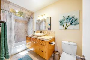 a bathroom with a sink and a shower at Timber Top Retreat in Lake Arrowhead +23 photos