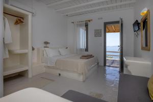 Ένα ή περισσότερα κρεβάτια σε δωμάτιο στο Big Blue Suites & Apartments +129 φωτογραφίες