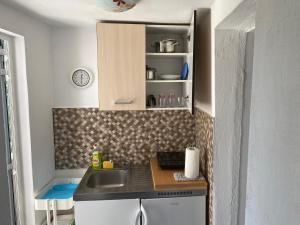 Kuchyň nebo kuchyňský kout v ubytování Apartment Surdić