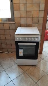 a stove sitting on the floor in a kitchen at ORO BIANCO in Marsala