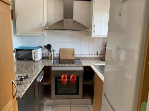 Kuchyň nebo kuchyňský kout v ubytování La Casita de la Playa 24-38