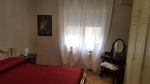 Łóżko lub łóżka w pokoju w obiekcie casadifederica