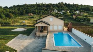 an aerial view of a house with a swimming pool at Villa Lila in Mostar
