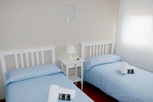 Postel nebo postele na pokoji v ubytování ÁTICO DUPLEX CREDENCIAL
