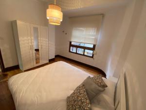 Cama o camas de una habitación en Piso Alameda Marin