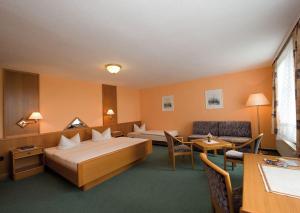 Postel nebo postele na pokoji v ubytování Panoramahotel Wolfsberg