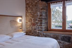 Posteľ alebo postele v izbe v ubytovaní Apartamentos Ea Astei