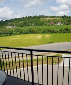 a view of a golf course from a balcony at Apartament 3 Budiu in Târgu-Mureş