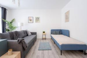 Posteľ alebo postele v izbe v ubytovaní Szabolcs Apartments