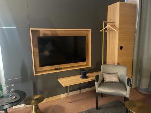 TV a/nebo společenská místnost v ubytování Pause